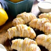 Lemon Cheesecake Crescent Rolls are bursting with bright lemon flavor! Flaky crescent rolls filled with creamy lemon cheesecake, topped with a citrus glaze...the perfect brunch recipe!