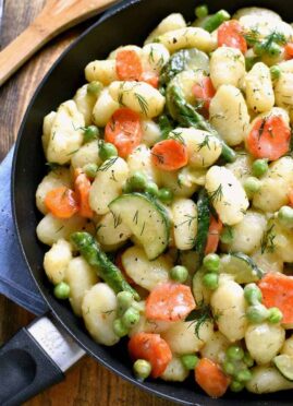 This Spring Vegetable Gnocchi is creamy, delicious, and comfort food at its finest. This gnocchi is loaded with fresh vegetables and comes together in under 20 minutes.